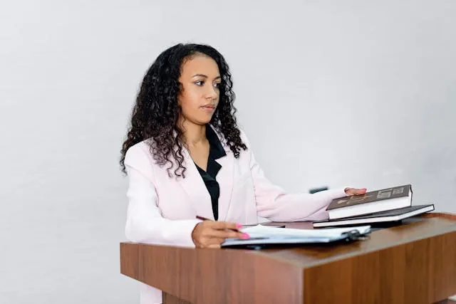 Witness participating in a remote deposition, demonstrating effective body language and professional video setup.